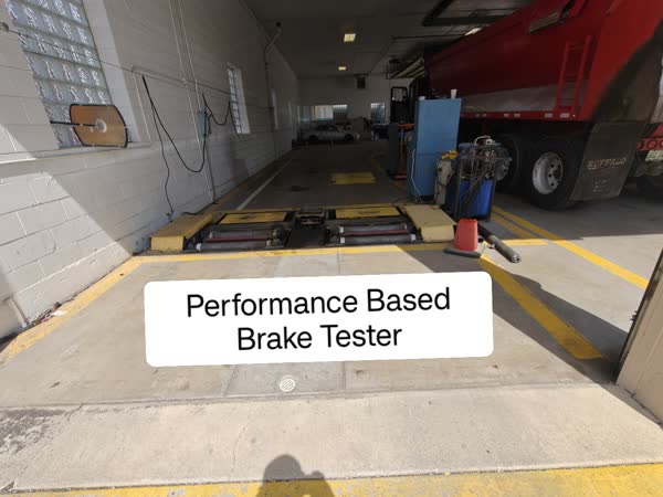 Performance-based brake tester inside the James Drive Safety Lane inspection bay.