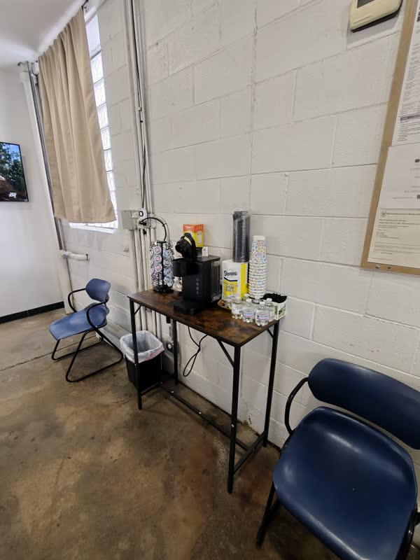 Free coffee and water for customers in the waiting room.